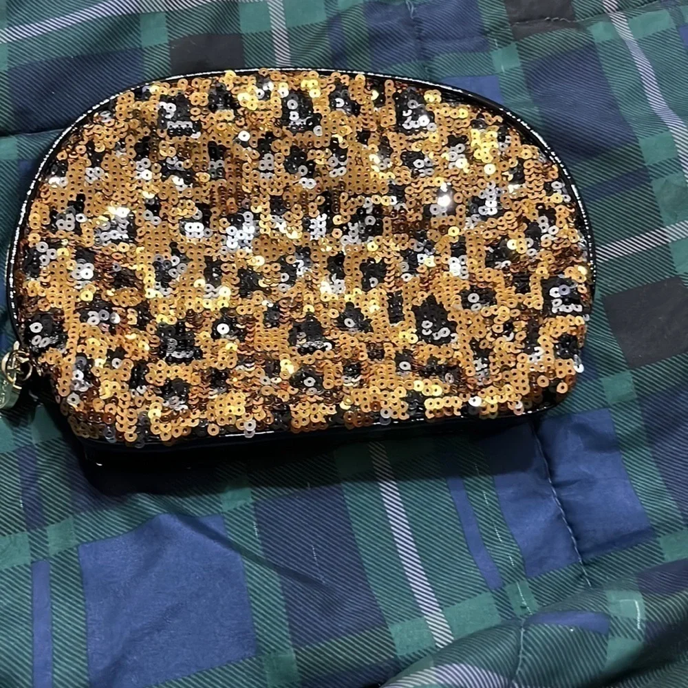 Betsey Johnston gold and black sequined  cosmetic bag. Good condition